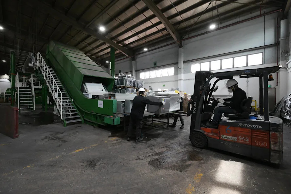 Old refrigerators about to be crushed at Cimelia Resource Recovery’s centre on Oct 10.