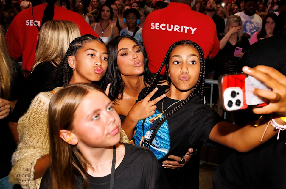 North West and friends pose with Kim Kardashian for a selfie at a concert