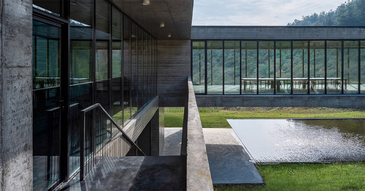 floating concrete structure by moguang studio anchors guesthouse complex in china