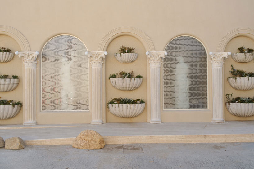 dessert-shaped sculptures in marble and wood ornament ice cream shop in argentina