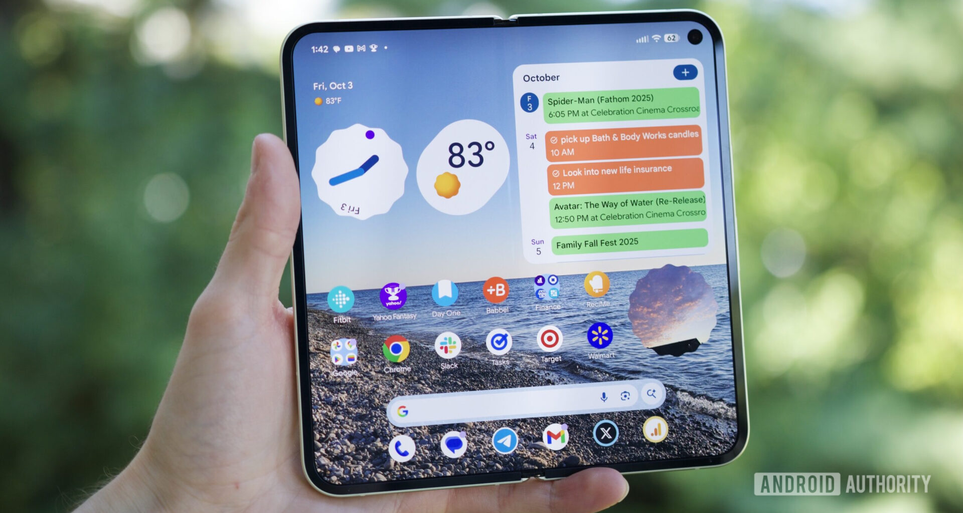 Someone holding the Google Pixel 10 Pro Fold with its inner screen open and turned on.