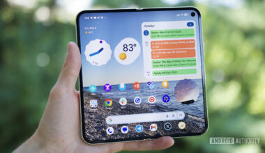 Someone holding the Google Pixel 10 Pro Fold with its inner screen open and turned on.
