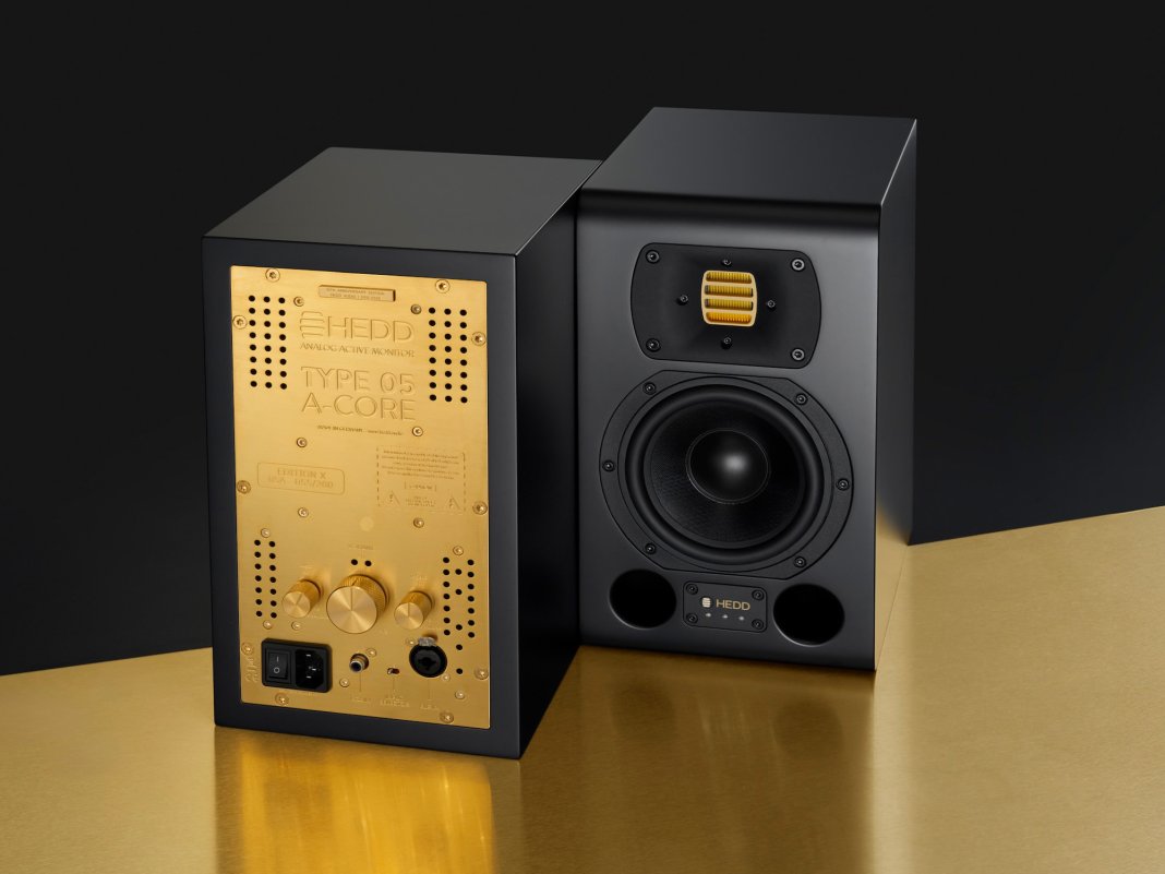 Edition X monitor pair. One shows the front of the monitor, the other shows a golden back panel.