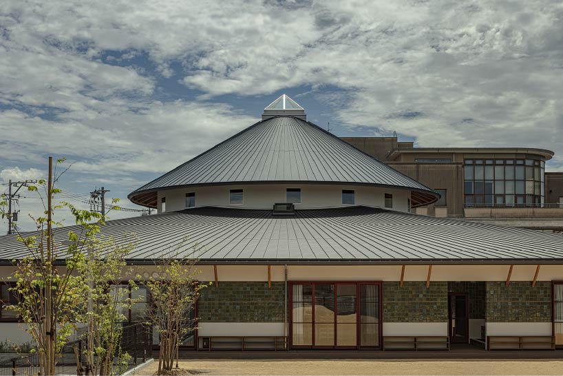 curved wooden frame shapes light-filled daycare center in japan encouraging playful learning