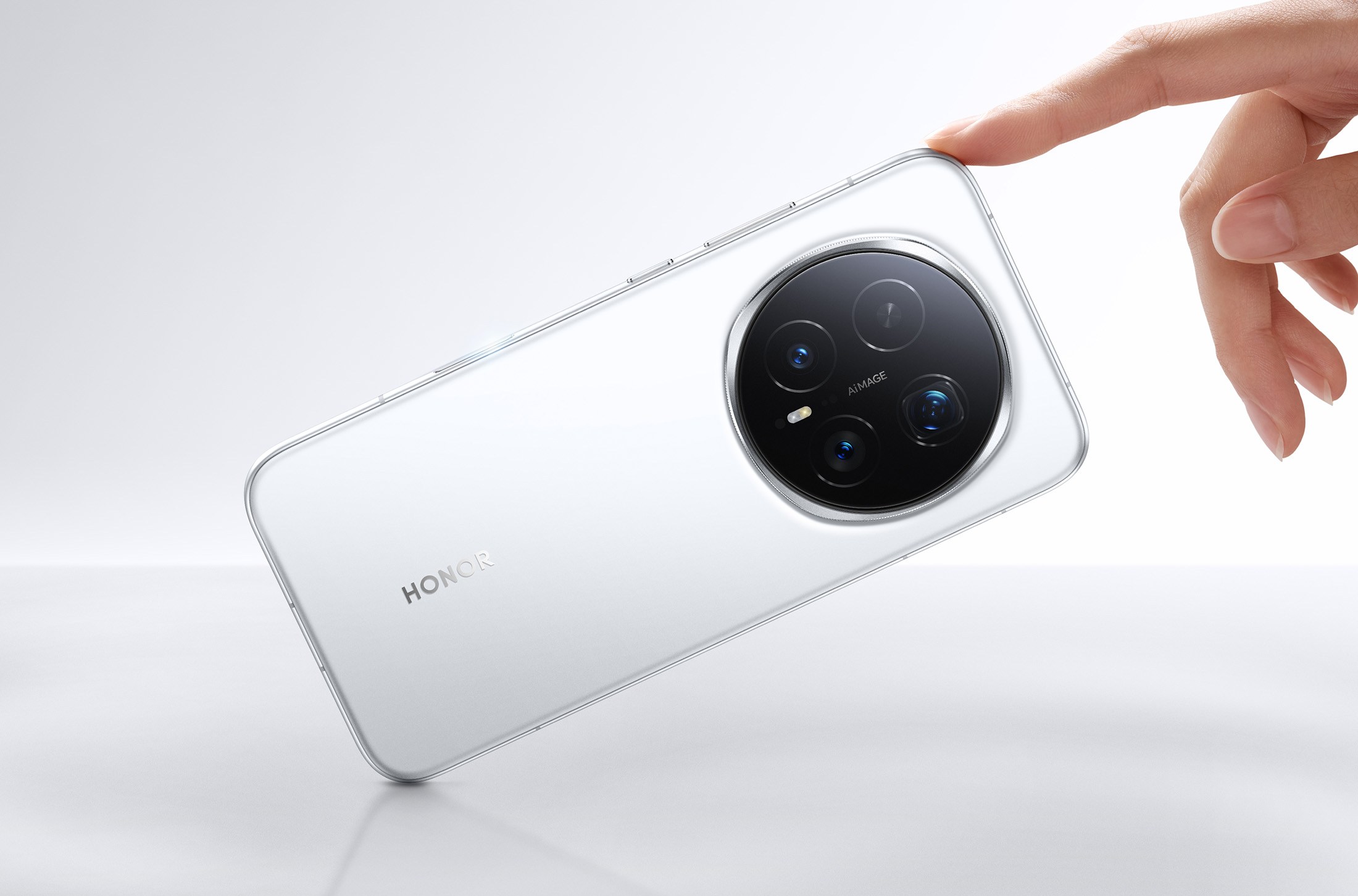 Honor Magic 8 Pro in white, resting against a finger