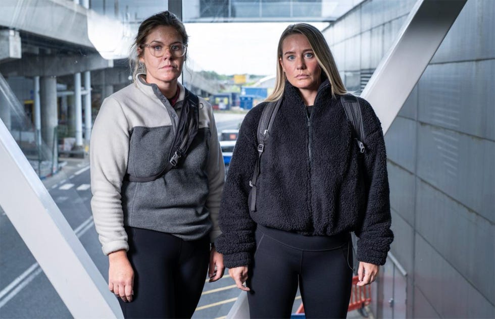 Hunted 2025 contestants Jenni and Emma two individuals wearing casual outerwear in an urban environment