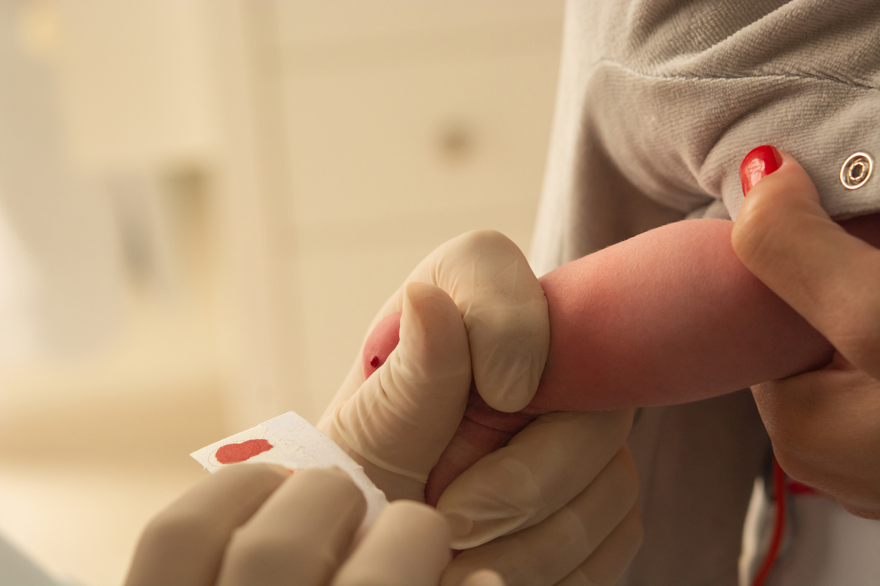 closeup of examining foot in newborn, (foot test)