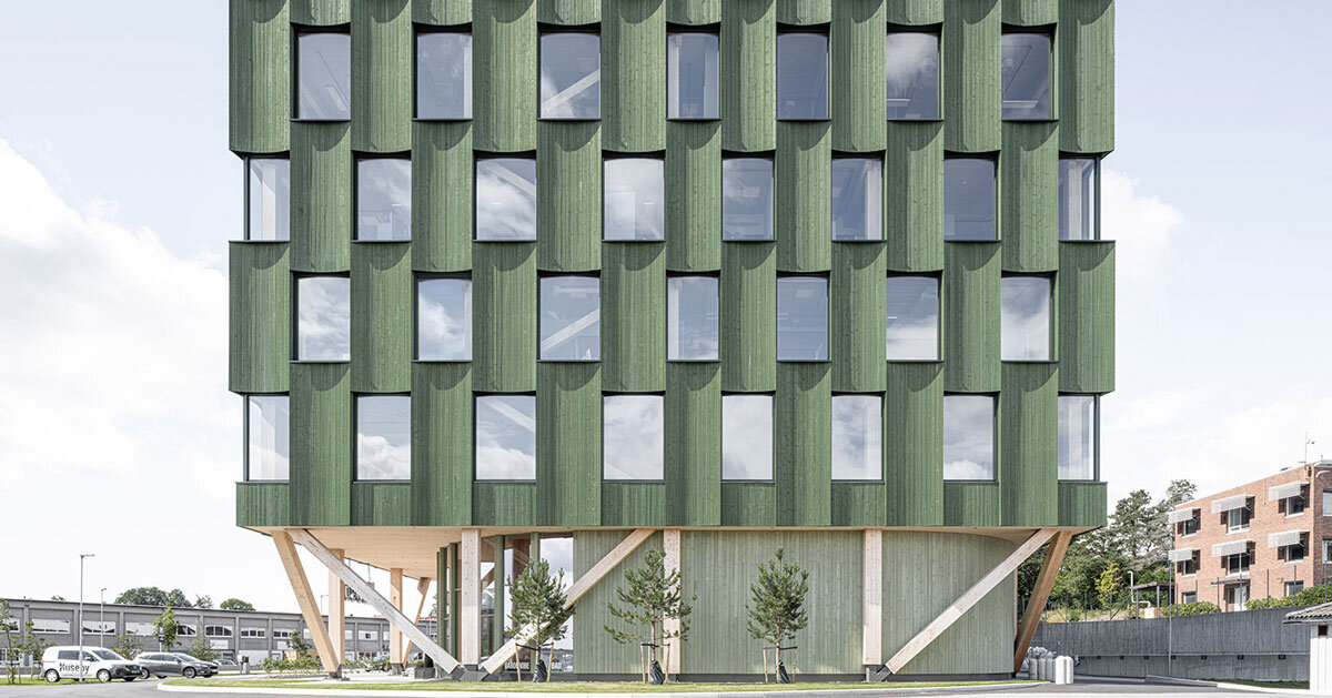 green timber curves sculpt rhythmic facade for office building in norway