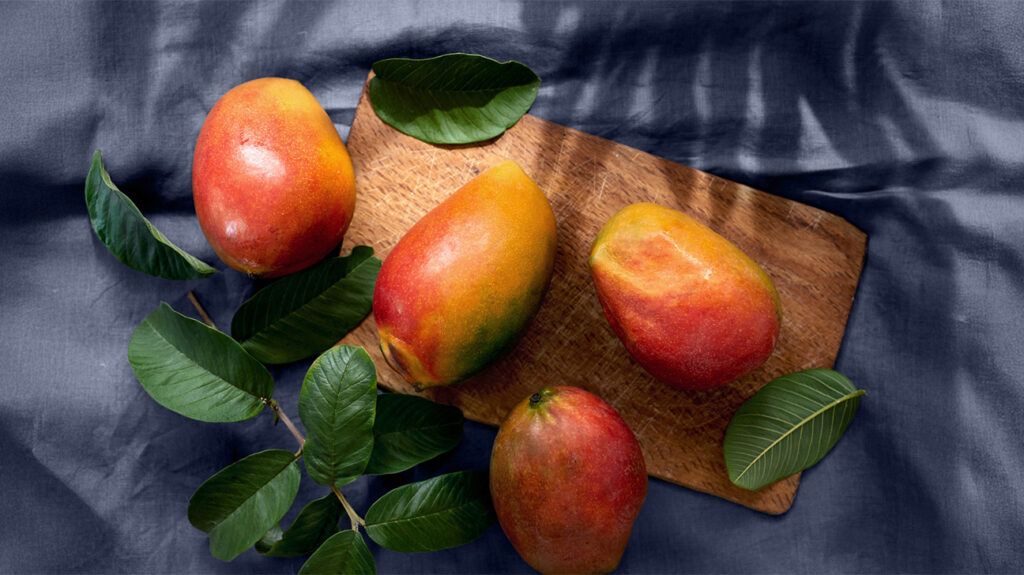 for mangoes on a cutting board