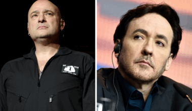 David Draiman of Disturbed onstage in 2025, next to a picture of John Cusack in 2016