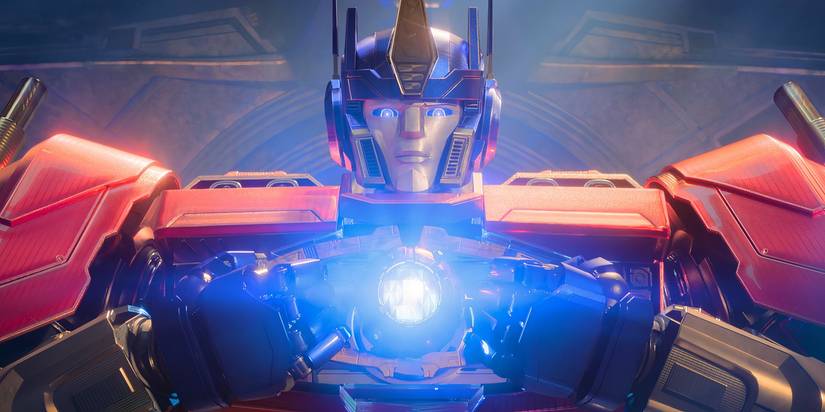 Optimus Prime looking solemn holding the  Matrix of Leadership in Transformers One