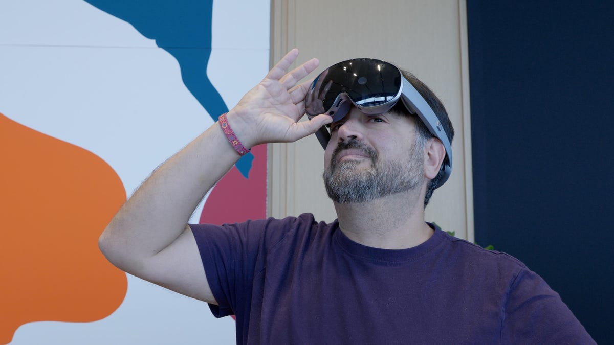 Samsung Galaxy XR headset on the face of CNET&apos;s Scott Stein
