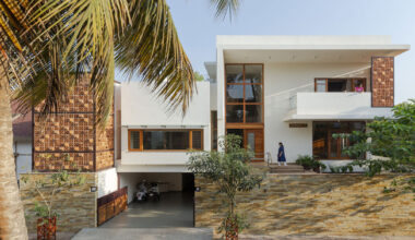 perforated terracotta screens enclose pool within indian residence