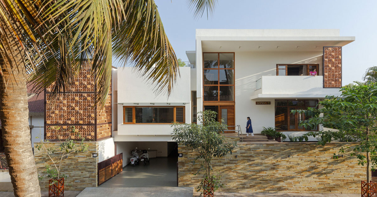 perforated terracotta screens enclose pool within indian residence