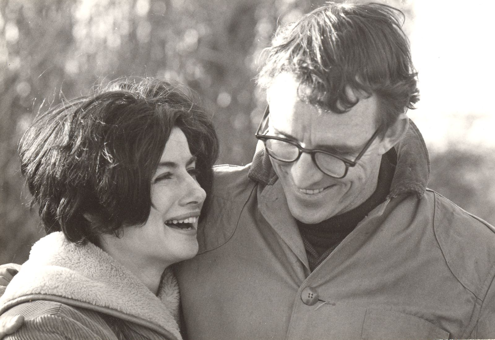 A man and a woman embrace.