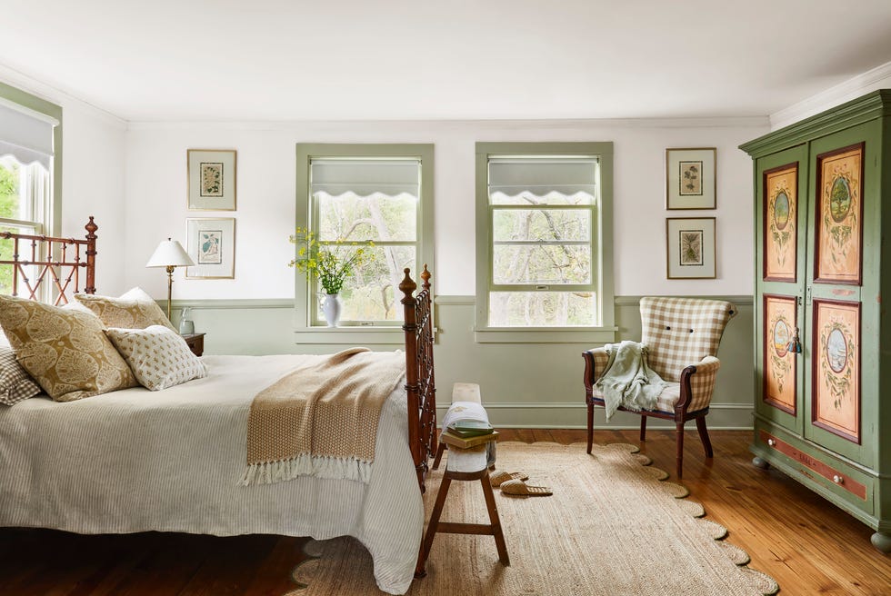 cozy bedroom with natural rug and bed with white linens