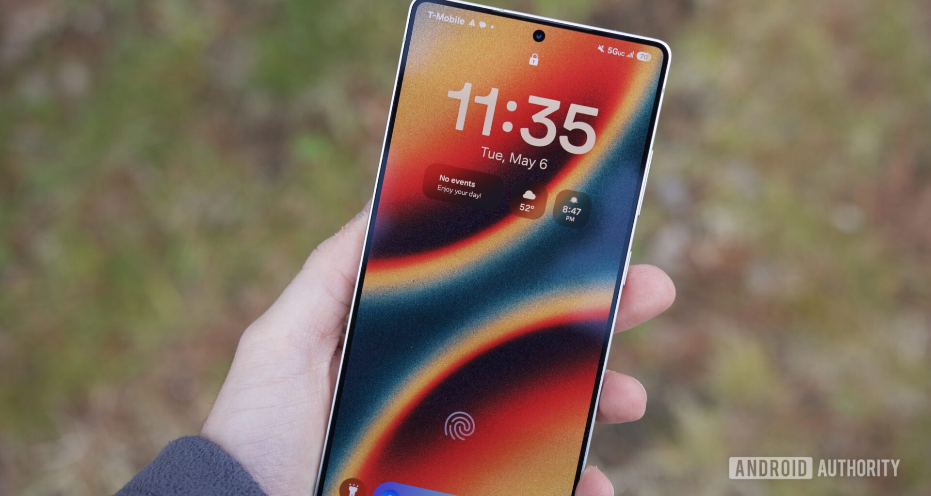 Someone holding the Samsung Galaxy S25 Ultra with its display turned on.