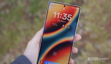 Someone holding the Samsung Galaxy S25 Ultra with its display turned on.