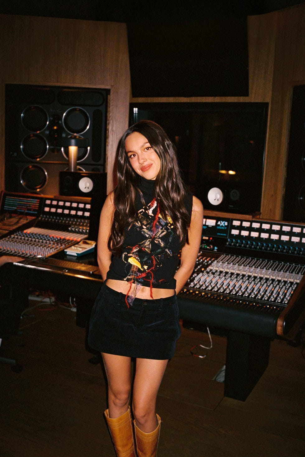 olivia rodrigo standing in a music studio olivia rodrigo standing in a music studio