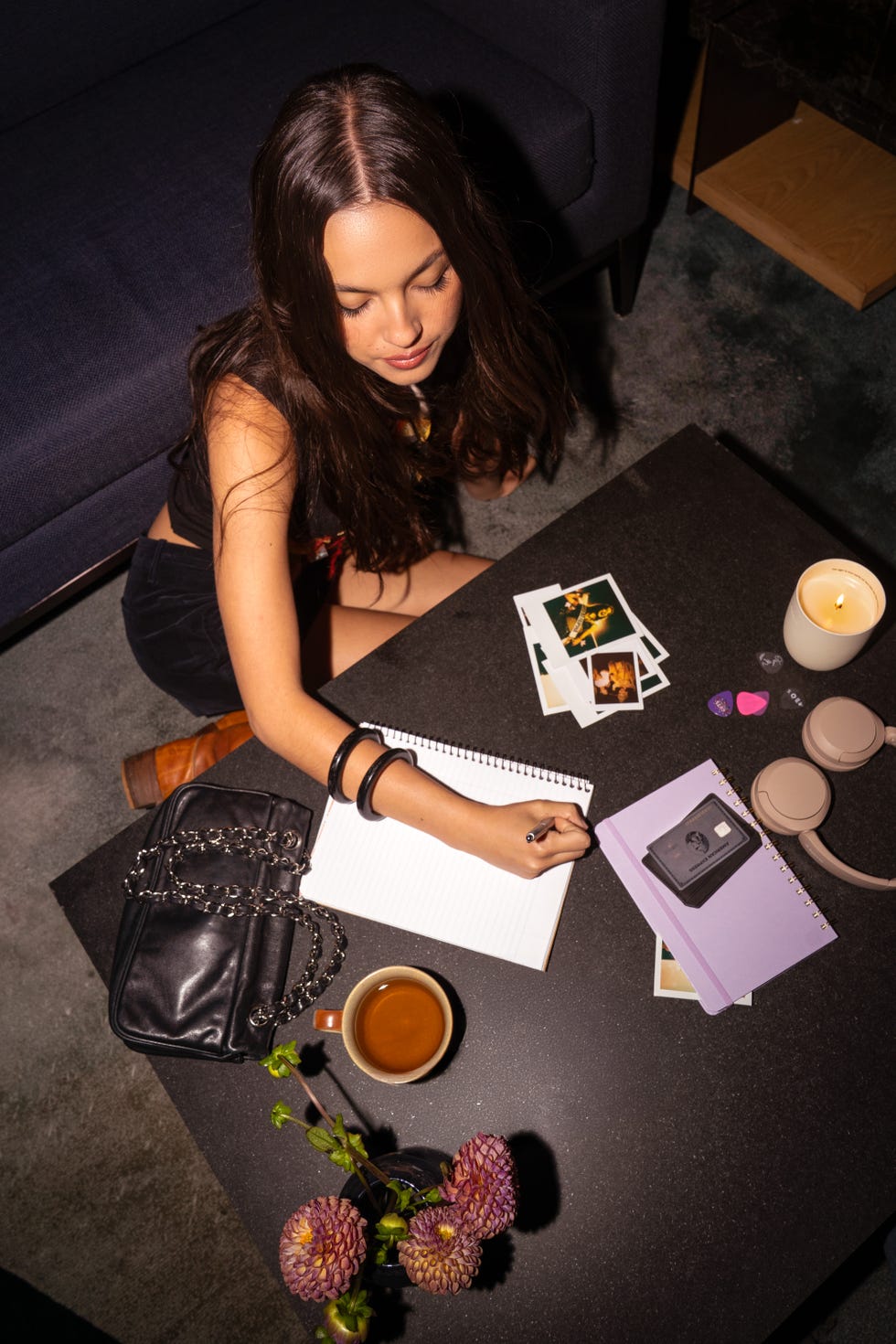 olivia rodrigo sitting down and writing in a notebook olivia rodrigo sitting down and writing in a notebook