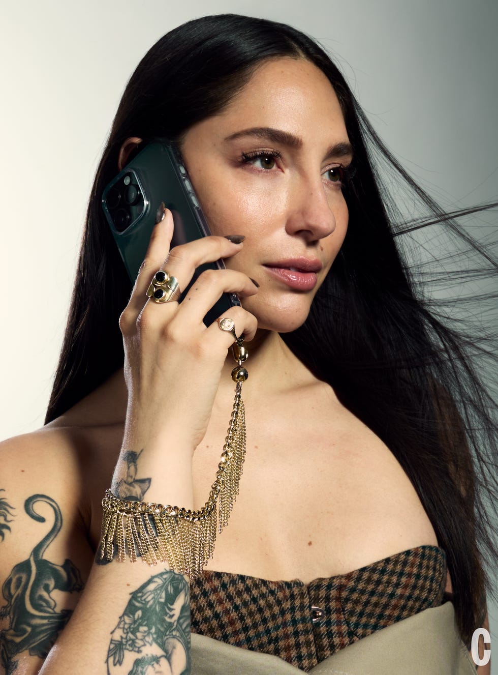 woman holding phone to ear