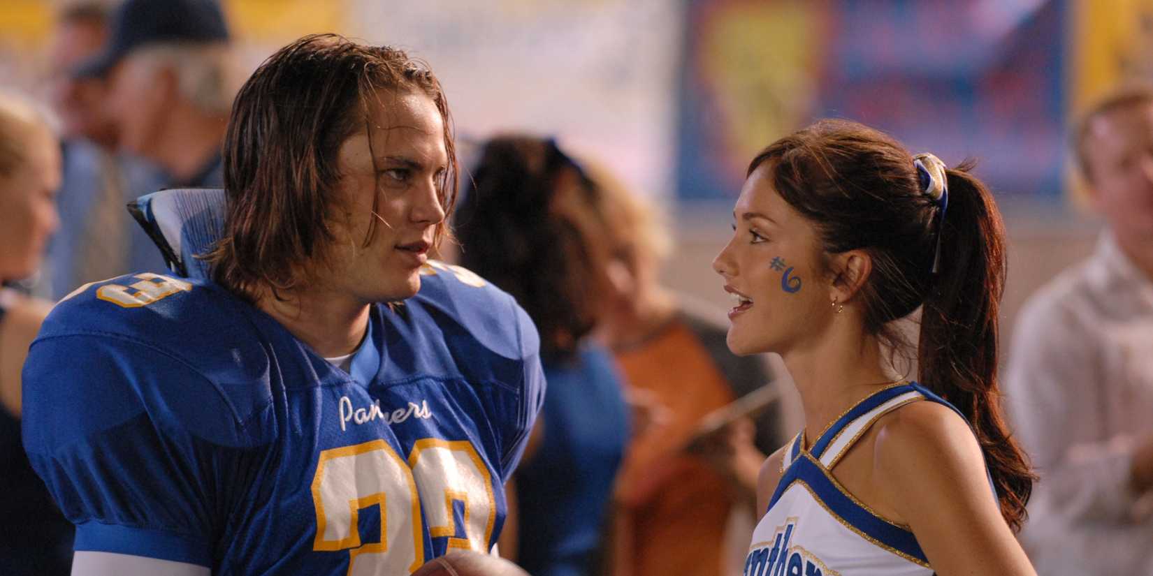 Tim Riggins (Taylor Kitsch) talking to Lyla Garrity (Minka Kelly) on Friday Night Lights