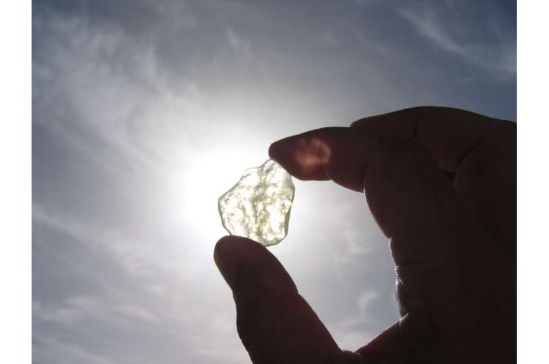 Fragment of clear Libyan Desert glass refracts intense sunlight in the Great Sand Sea of Egypt, during a research expedition for the BBC/National Geographic documentary "Tutankhamun's Fireball" in which Boslough first proposed the hypothesis that it was formed by a "type 2" (also called "touchdown") airburst event. Credit: Mark Boslough, Feb. 2006 UNM research suggests Halloween fireballs could signal increased risk of cosmic impact or airburst in 2032 and 2036
