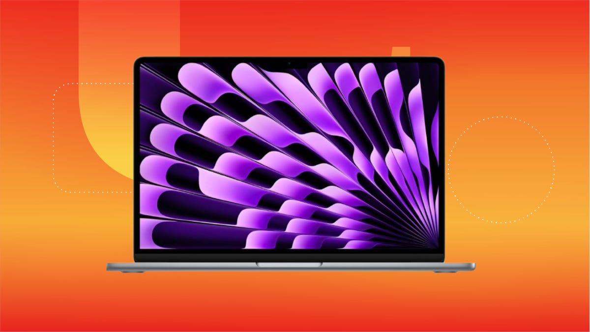 A gray MacBook Air displaying purple and black wallpaper, set against an orange gradient background.