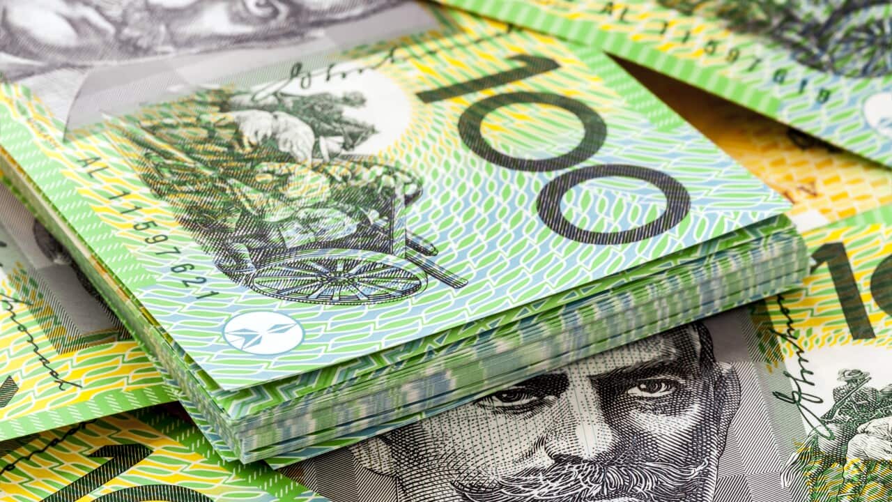 A pile of Australian $100 banknotes