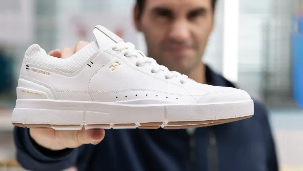 Roger Federer with his signature tennis shoe