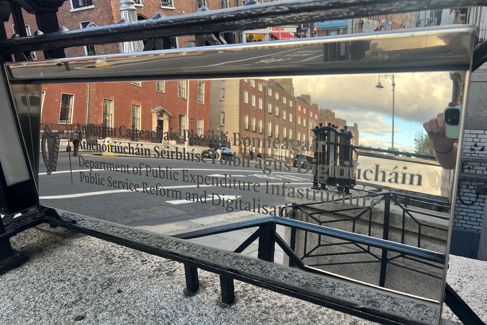 Old sign outside Department of Public Expenditure with misspelling