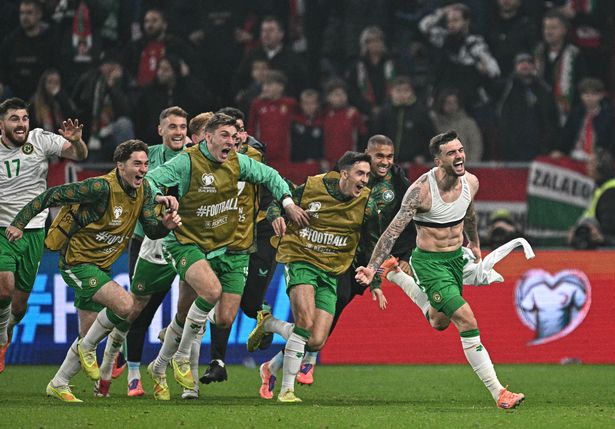 Ireland's forward #07 Troy Parrott (R) celebrates his 2-3 during the FIFA World Cup 2026 Group F European qualification football match betweem Hungary and Republic of Ireland at the Puskas Arena in Budapest, Hungary on Novemeber 16, 2025. (Photo by Attila KISBENEDEK / AFP) (Photo by ATTILA KISBENEDEK/AFP via Getty Images)