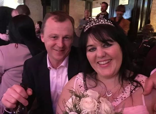 Lisa with her husband, Gary, on their wedding day