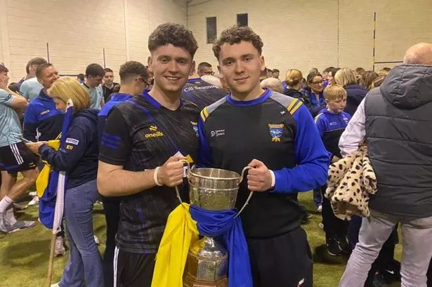 Jack Kavanagh (right) and his big brother Tim (left) with the premier intermediate football cup won by Kilshannig GAA last year