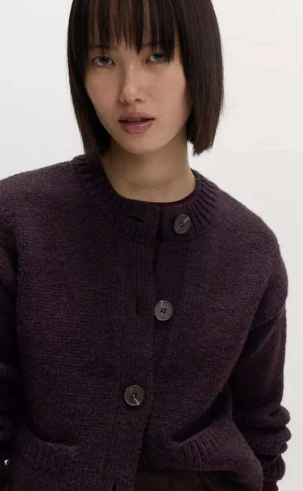 a woman in a cardigan