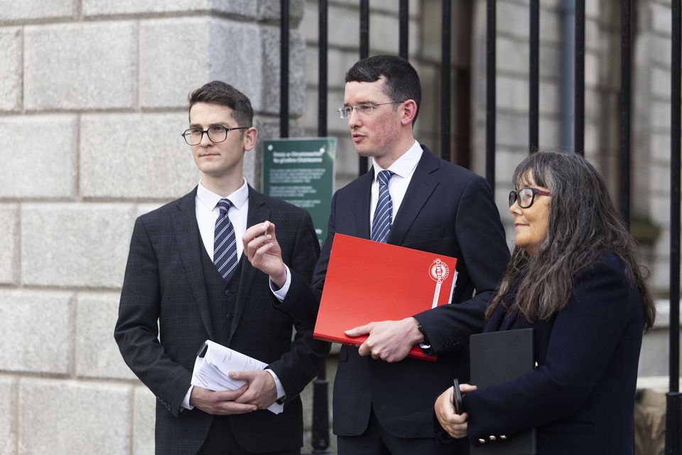 Isaac, Enoch and Martina Burke at the High Court. Photo: Collins Courts.