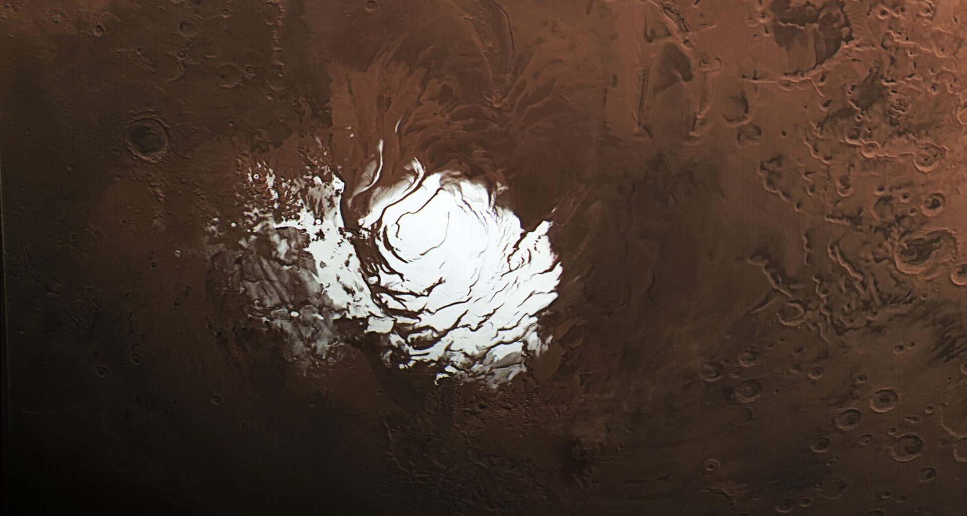 The European Space Agency’s Mars Express orbiter captured this view of Mars’ south polar ice cap Feb. 25, 2015. Three years later, the spacecraft detected a signal from the area to the right of the ice cap that scientists interpreted as an underground lake.