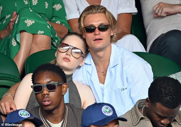 She cuddled up to the hunk while Novak Djokovic took on Australia's Alex de Minaur at Wimbledon in July, in their first public appearance together