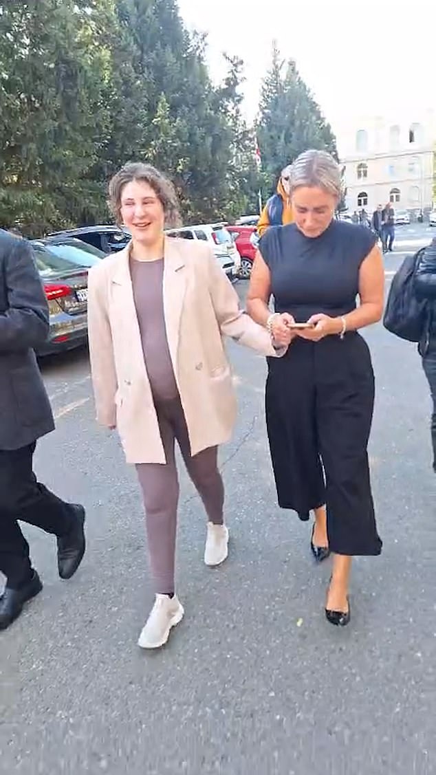 Culley was seen with her baby bump as she walked with her family and spoke to her father on the phone