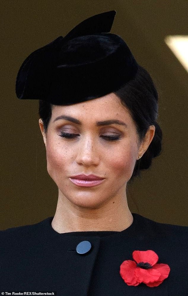 Meghan is pictured during the Remembrance service in 2018 before she stepped away as a working royal
