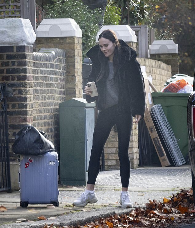 Holly Ramsay clutched a 'Bride' phone case as she broke cover on Thursday morning for the first time since her feud with fiancé Adam Peaty 's family came to light