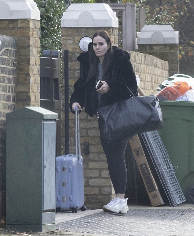 She wore a pair of box-fresh white trainers while heading out