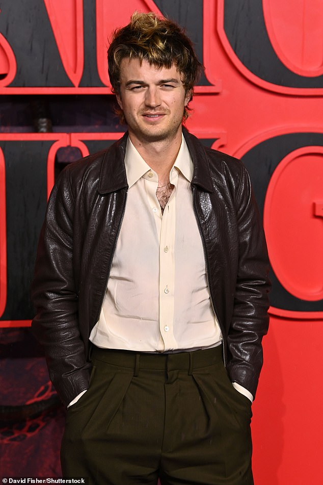 Joe Keery, who plays Steve Harrington, wore a brown leather jacket with an open satin shirt