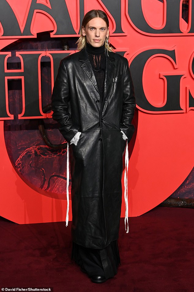 Jamie Campbell Bower put on an edgy display in a leather trench coat