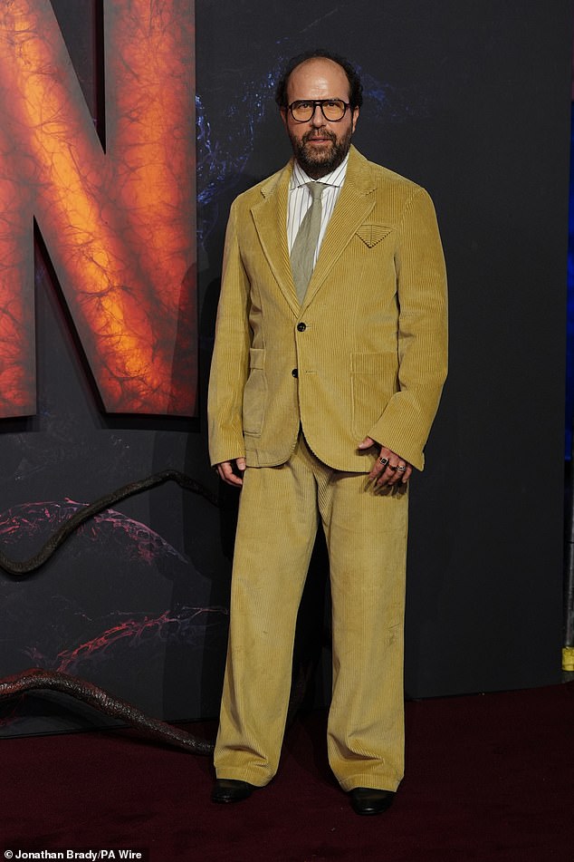 Brett Gelman looked quirky in a mustard yellow suit