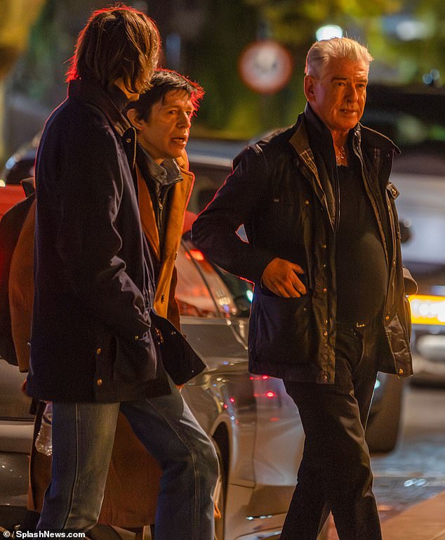 Pierce with Christopher and Dylan leaving a London restaurant in September