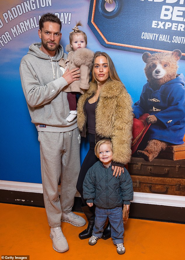 Lewis, meanwhile, cut a casual figure in a grey tracksuit, while Lucky looked adorable as he wore Paddington ears to the immersive experience