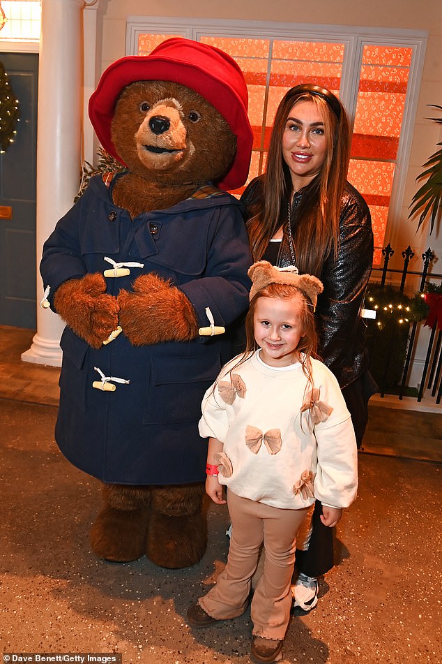 Lauren appeared in happy spirits during her mother-daughter outing as they posed alongside a statue of the famed bear