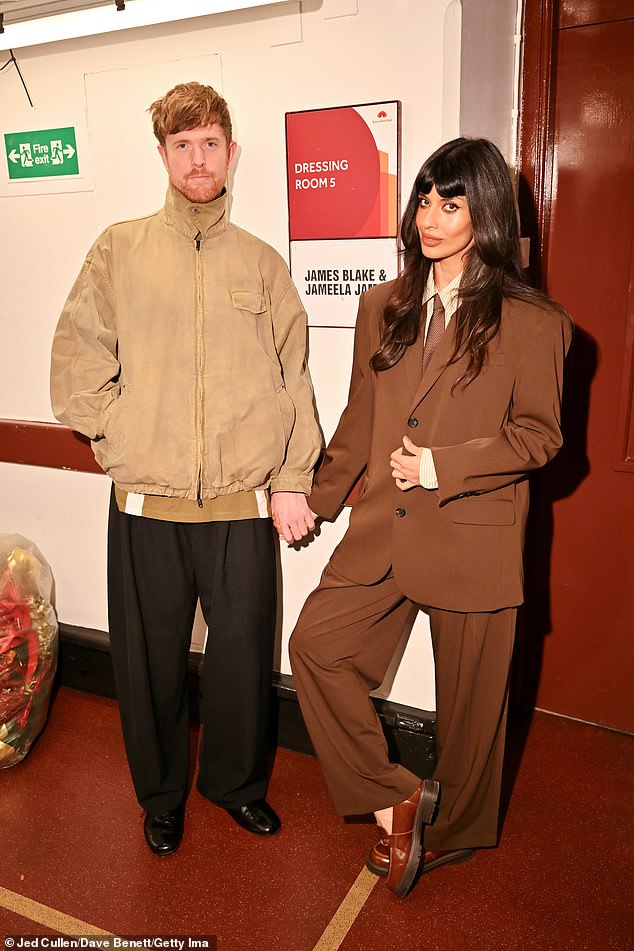 She was also joined by her record producer partner James Blake who cut a smart casual figure in a beige zip-up jacket and black trousers