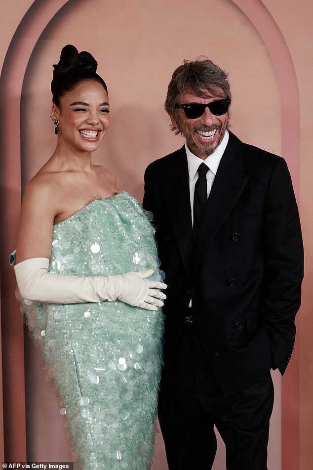 Tessa wore her hair up in a high bun and accessorised with drop earrings